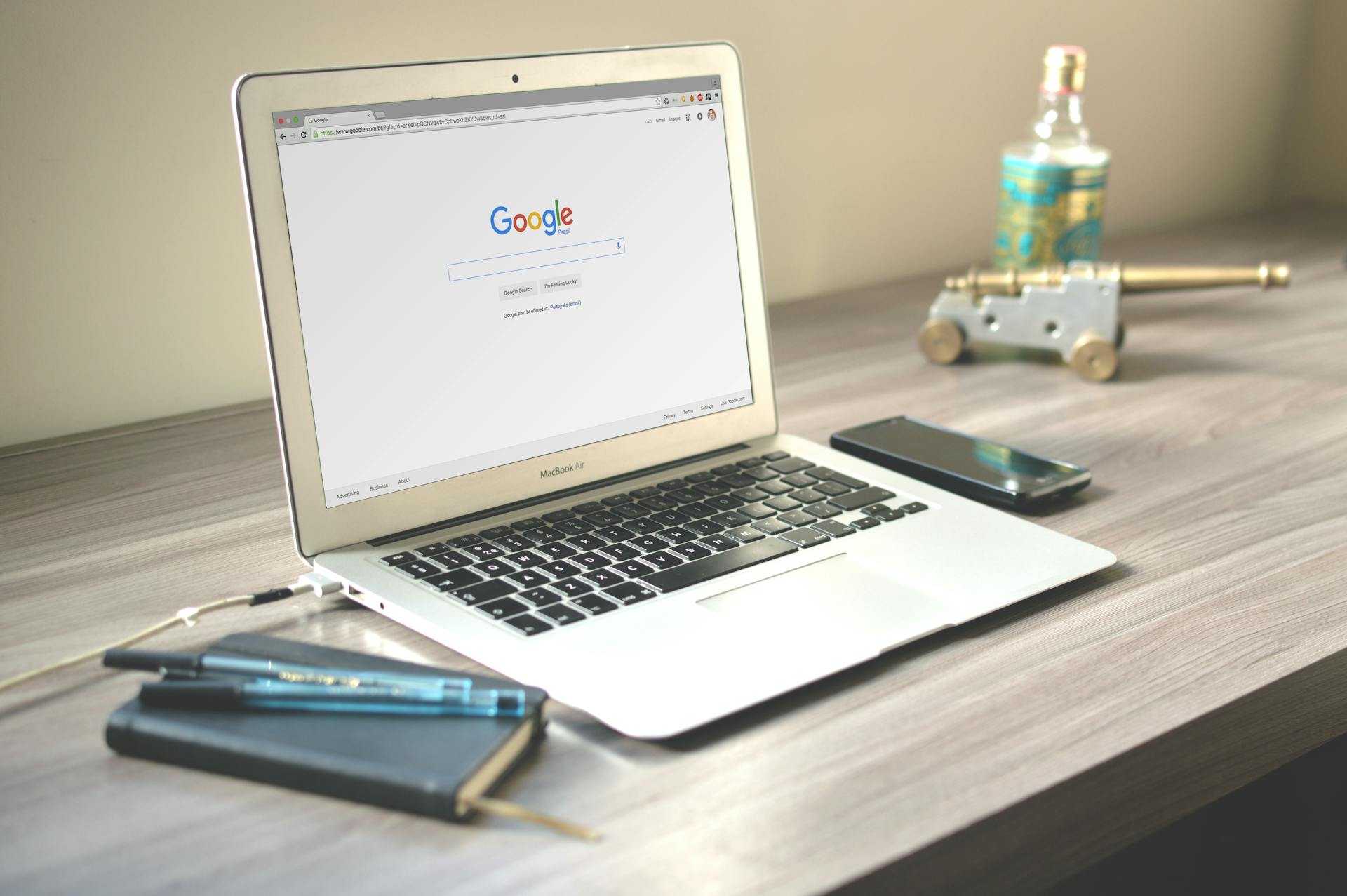 Computer on a table with Google.com opened